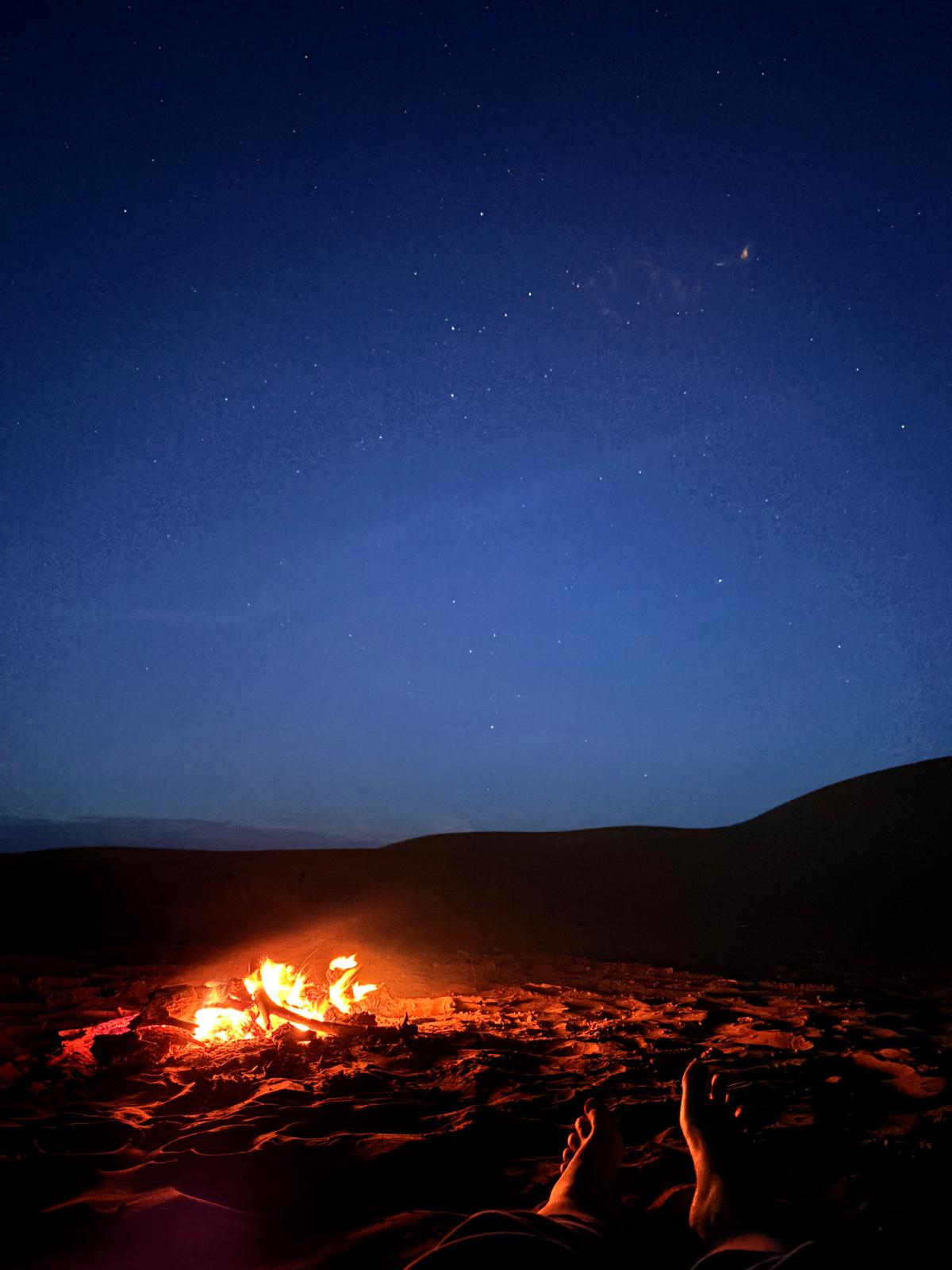 A fire beneath the desert stars