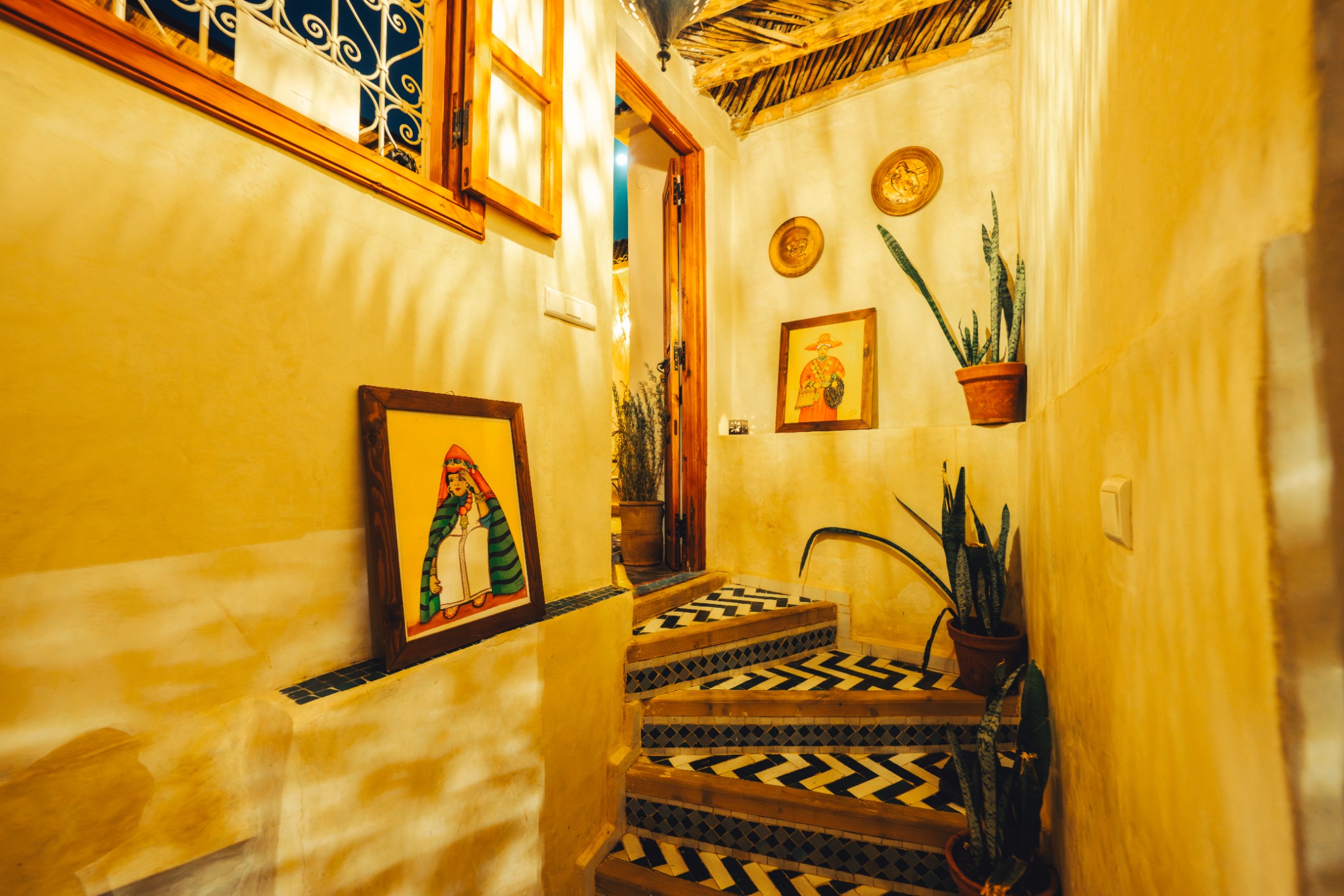 A warmly lit staircase in the newly created riad