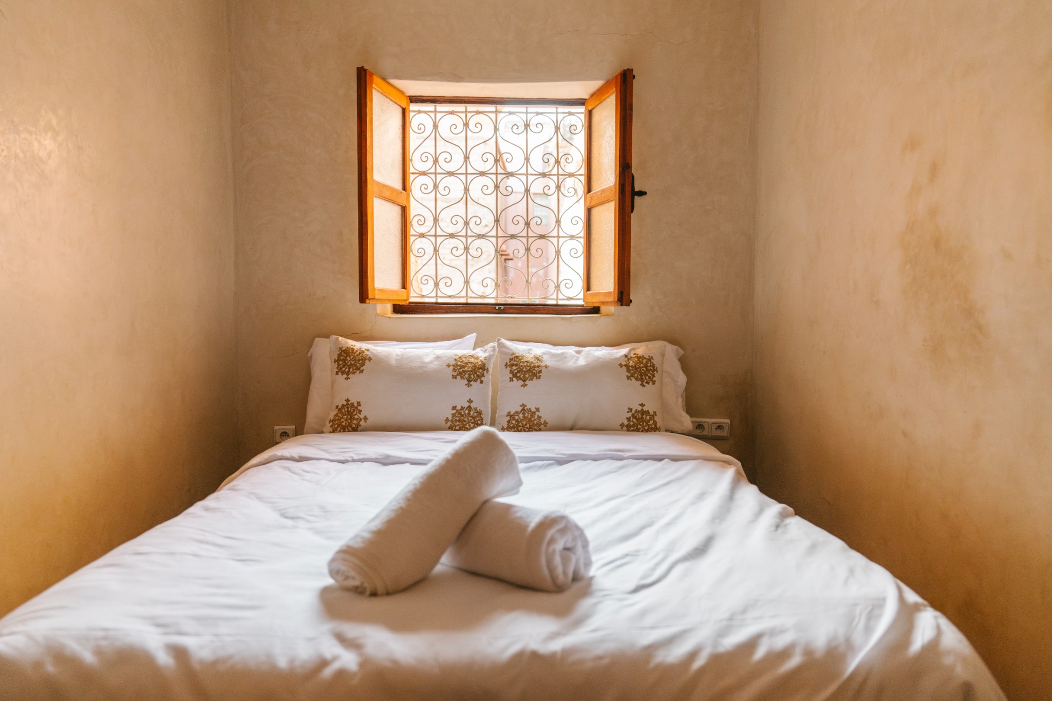 A quiet bedroom with an open window
