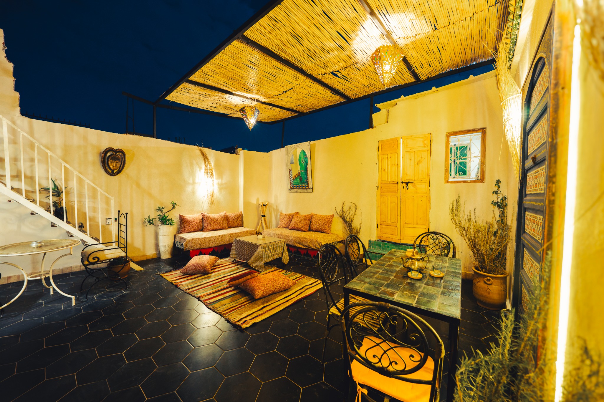 The illuminated riad courtyard in the evening