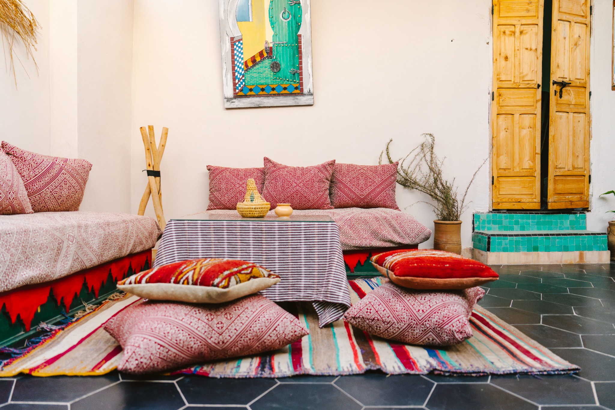 A seating area with patterned cushions in the courtyard